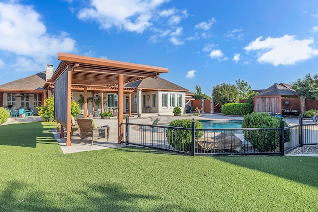 view of pool with a patio area and a lawn