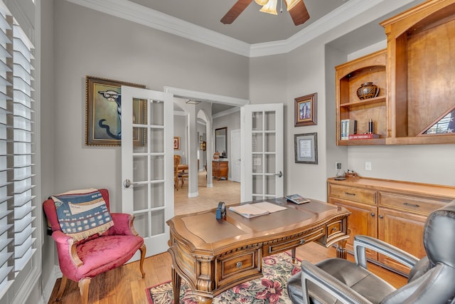 home office with ornamental molding, light hardwood / wood-style flooring, ceiling fan, and french doors