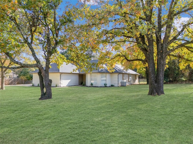 view of front of home featuring fence