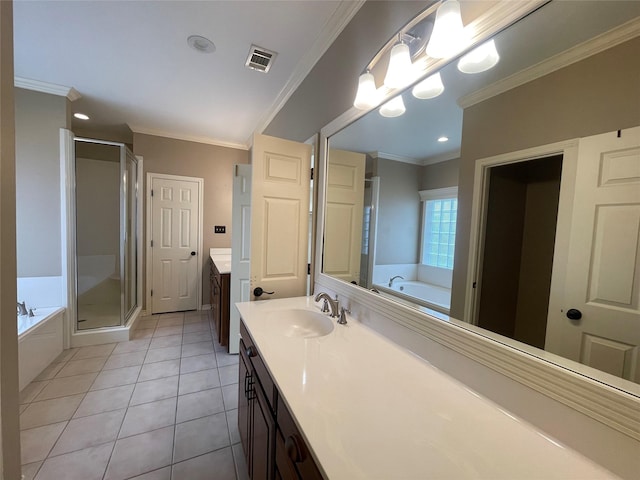 bathroom with ornamental molding, vanity, separate shower and tub, and tile patterned floors