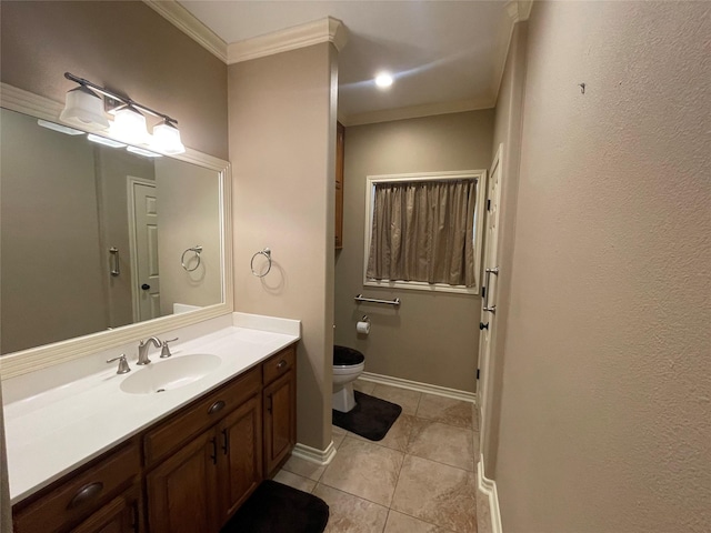 bathroom with vanity, crown molding, tile patterned floors, and toilet