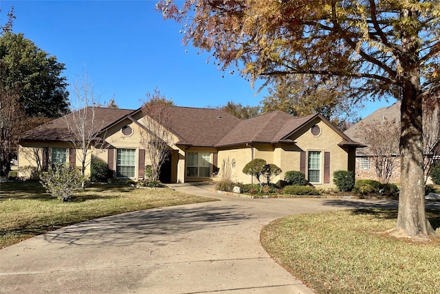 ranch-style house with a front lawn