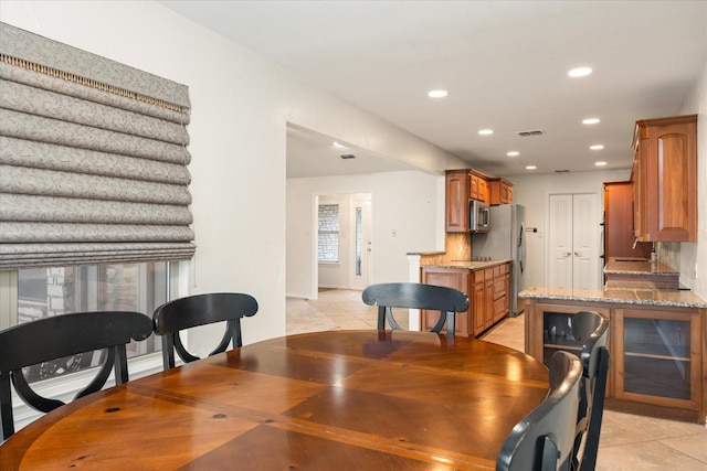 dining space with light tile patterned floors