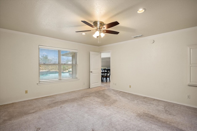 unfurnished room featuring light carpet and ornamental molding