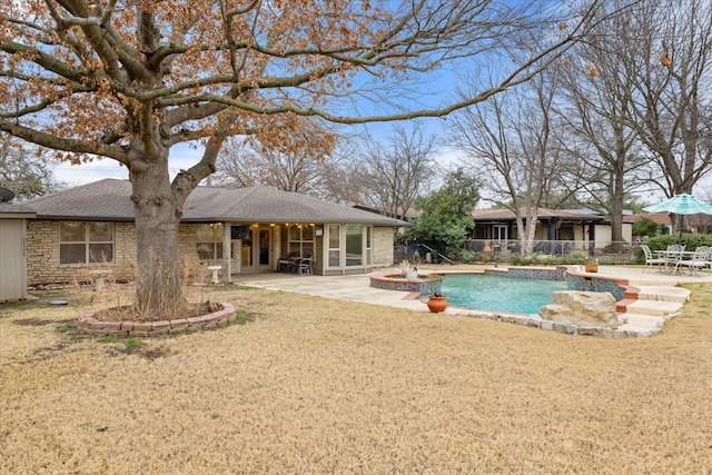 view of pool featuring a patio area and a lawn