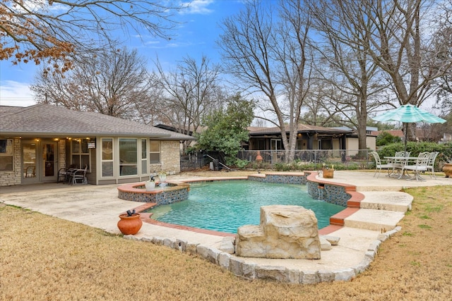 view of pool with an in ground hot tub and a patio area