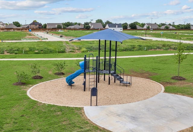 view of play area featuring a lawn