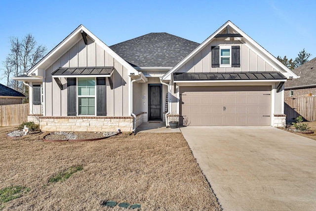 view of front of house featuring a garage and a front lawn