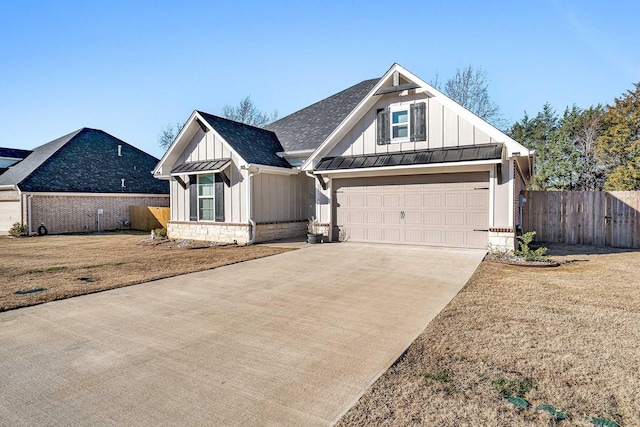 modern farmhouse style home with a front lawn