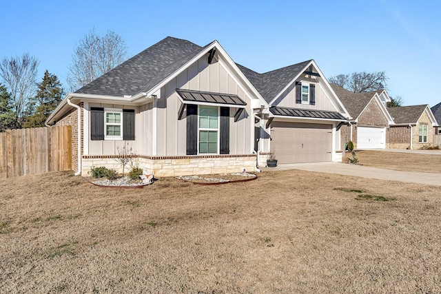 view of front of house featuring a garage and a front yard