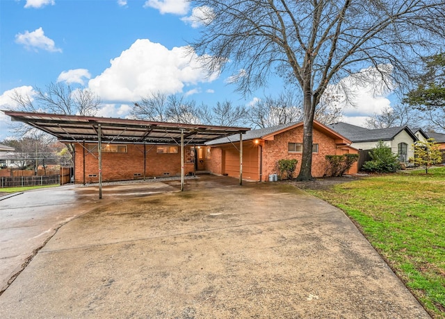 view of property exterior with a garage, a carport, and a lawn