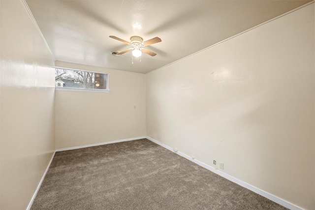 spare room with carpet and ceiling fan