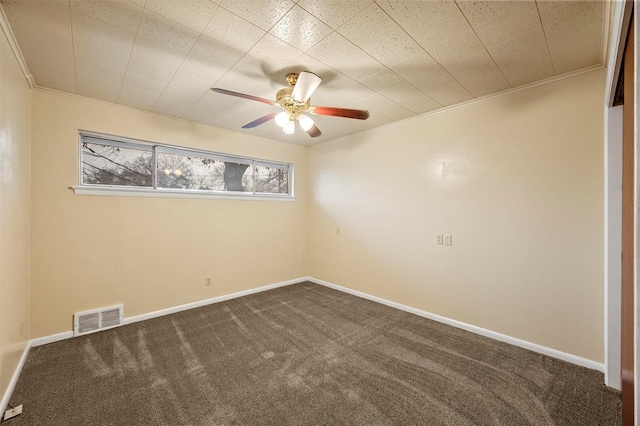 carpeted empty room featuring crown molding and ceiling fan