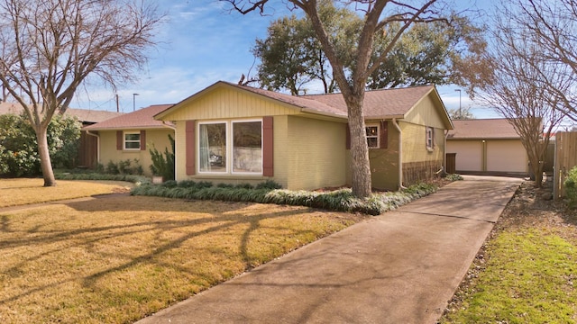 ranch-style home with a front lawn