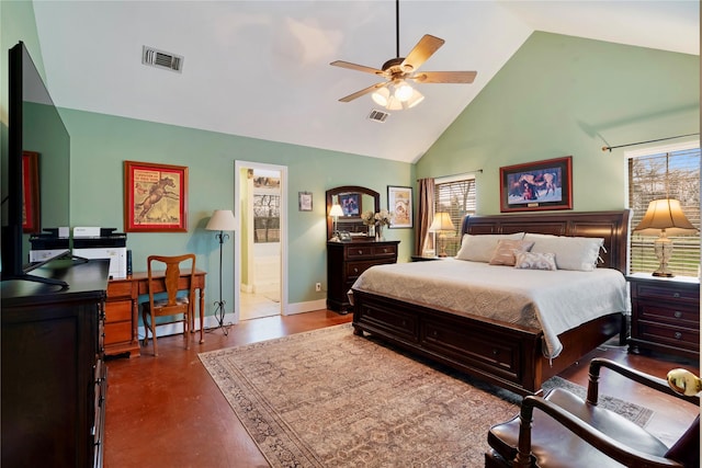 bedroom featuring high vaulted ceiling and ensuite bathroom