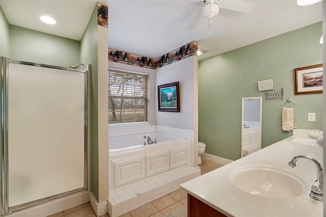 full bathroom featuring shower with separate bathtub, tile patterned flooring, vanity, ceiling fan, and toilet