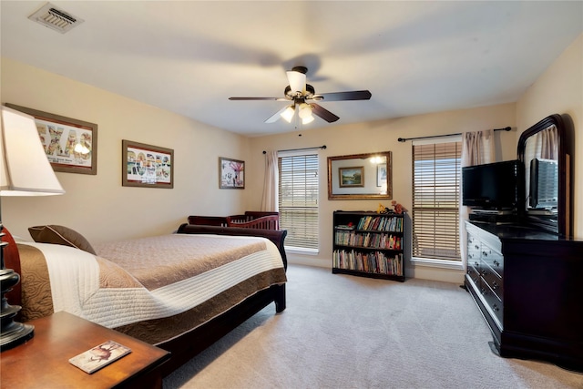 carpeted bedroom featuring ceiling fan