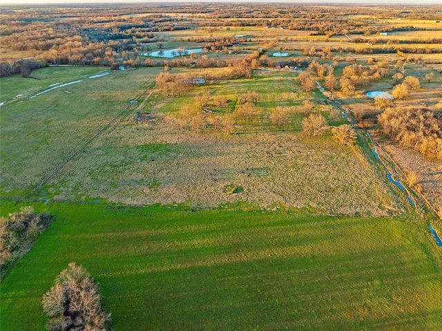 aerial view featuring a water view and a rural view