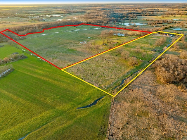 aerial view with a rural view and a water view
