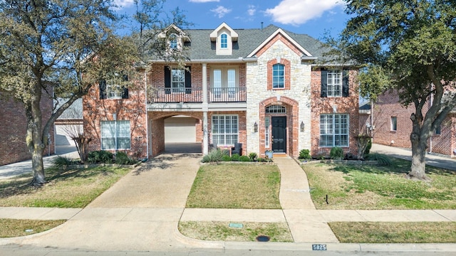 view of front of house with a garage and a front yard