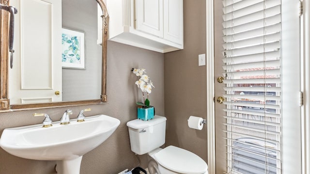 bathroom with sink and toilet