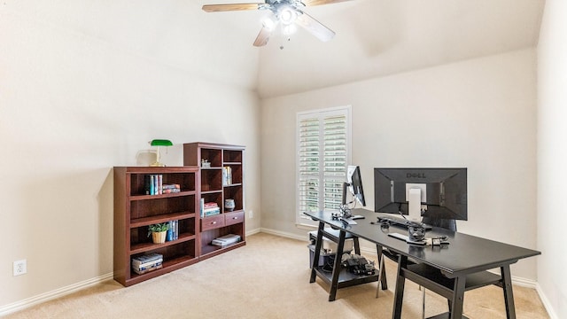 carpeted office with vaulted ceiling and ceiling fan