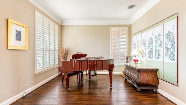 miscellaneous room with dark wood-type flooring, plenty of natural light, and ornamental molding