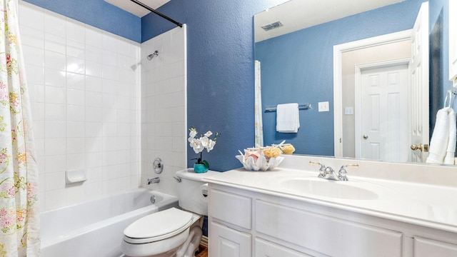 full bathroom featuring vanity, shower / tub combo with curtain, and toilet