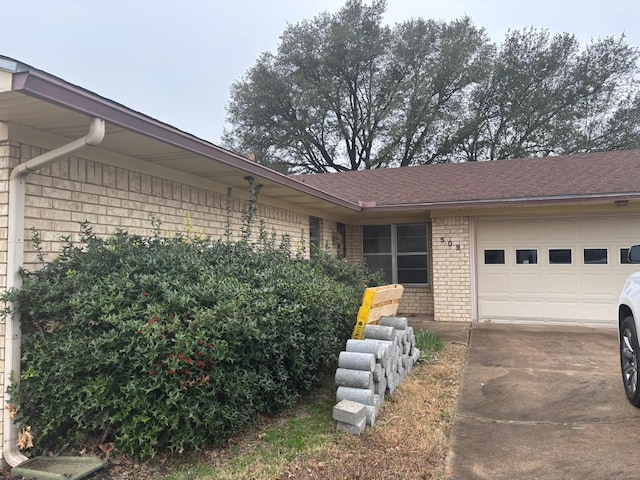 view of property exterior featuring a garage