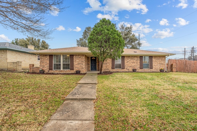 single story home featuring a front yard