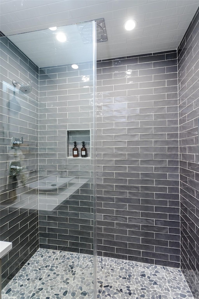 bathroom with tiled shower