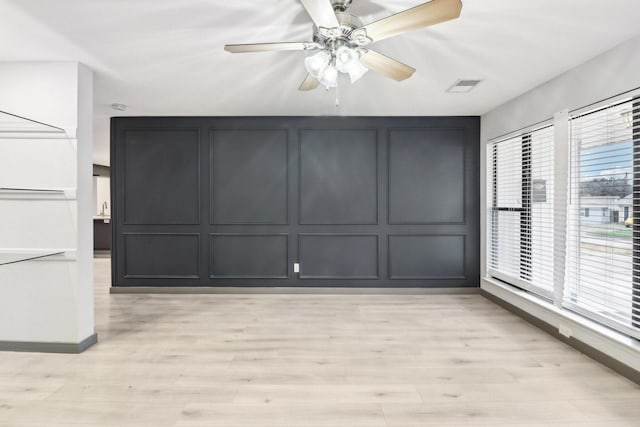 interior space featuring ceiling fan, a healthy amount of sunlight, and light hardwood / wood-style flooring