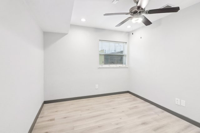 unfurnished room featuring ceiling fan and light wood-type flooring