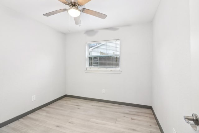 spare room with ceiling fan and light hardwood / wood-style floors