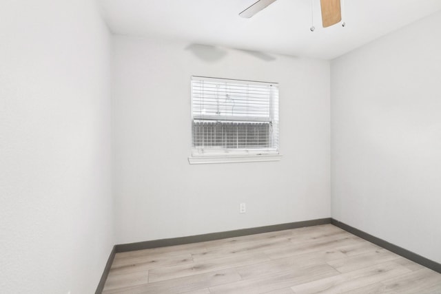 spare room with ceiling fan and light hardwood / wood-style flooring