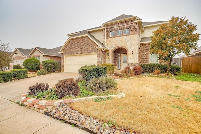 view of front property featuring a garage and a front yard