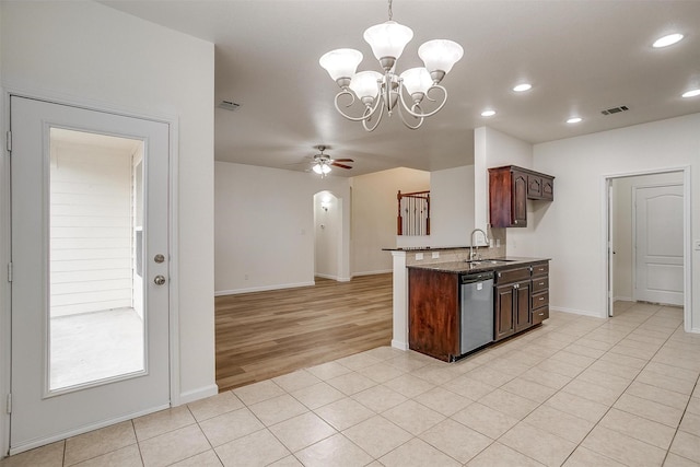 408 Elk Run Dr, Fort Worth, TX 76140 - kitchen with dark brown cabinetry, sink, light tile patterned floors, dishwasher, and ceiling fan with notable chandelier