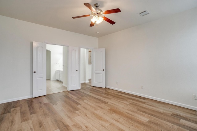 408 Elk Run Dr, Fort Worth, TX 76140 - unfurnished bedroom featuring ceiling fan, ensuite bathroom, and light wood-type flooring