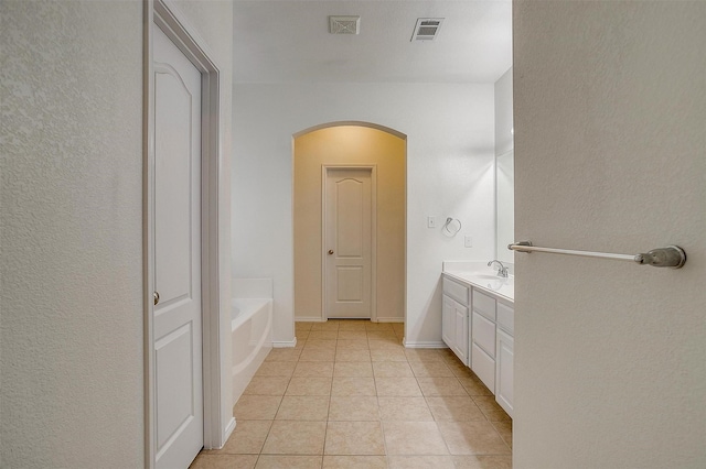 408 Elk Run Dr, Fort Worth, TX 76140 - bathroom with vanity, a washtub, and tile patterned flooring