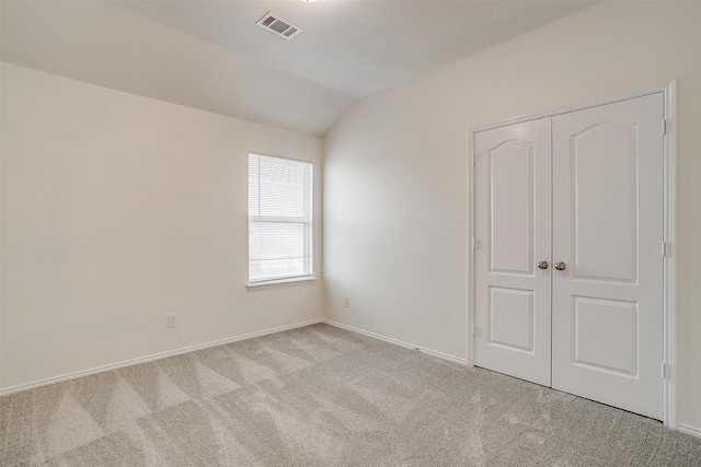 408 Elk Run Dr, Fort Worth, TX 76140 - unfurnished bedroom with light carpet, lofted ceiling, and a closet