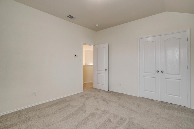 408 Elk Run Dr, Fort Worth, TX 76140 - unfurnished bedroom featuring vaulted ceiling, light carpet, and a closet