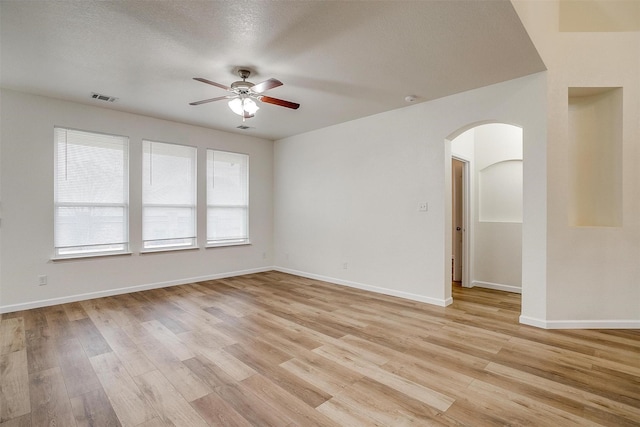 408 Elk Run Dr, Fort Worth, TX 76140 - empty room featuring a textured ceiling, ceiling fan, and light hardwood / wood-style flooring
