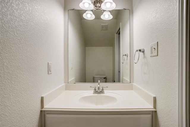 408 Elk Run Dr, Fort Worth, TX 76140 - bathroom with vanity, toilet, and a chandelier
