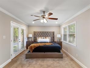 bedroom with crown molding, access to exterior, and french doors