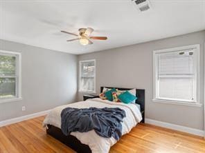 bedroom with hardwood / wood-style flooring and ceiling fan