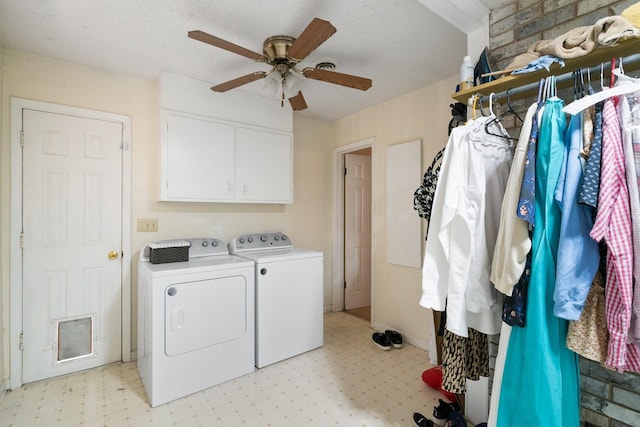 washroom featuring washing machine and dryer, cabinets, a textured ceiling, and ceiling fan