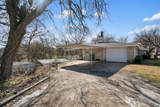 view of home's exterior with a garage and a carport