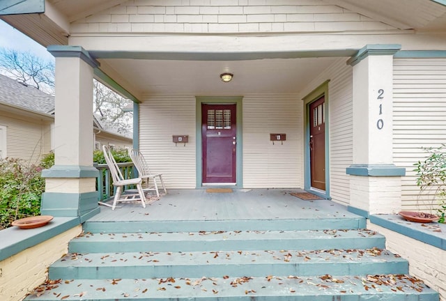 property entrance with covered porch