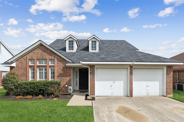 view of front facade with a garage and a front lawn