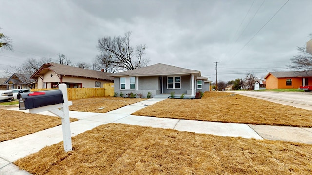 ranch-style house featuring a front yard